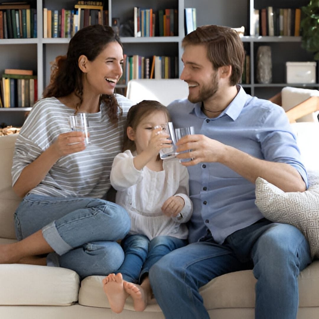Family on sofa drinking water happy 9bbac169 0f4b 41d8 b93f 0e2a46ccec16 - High Quality Product Image