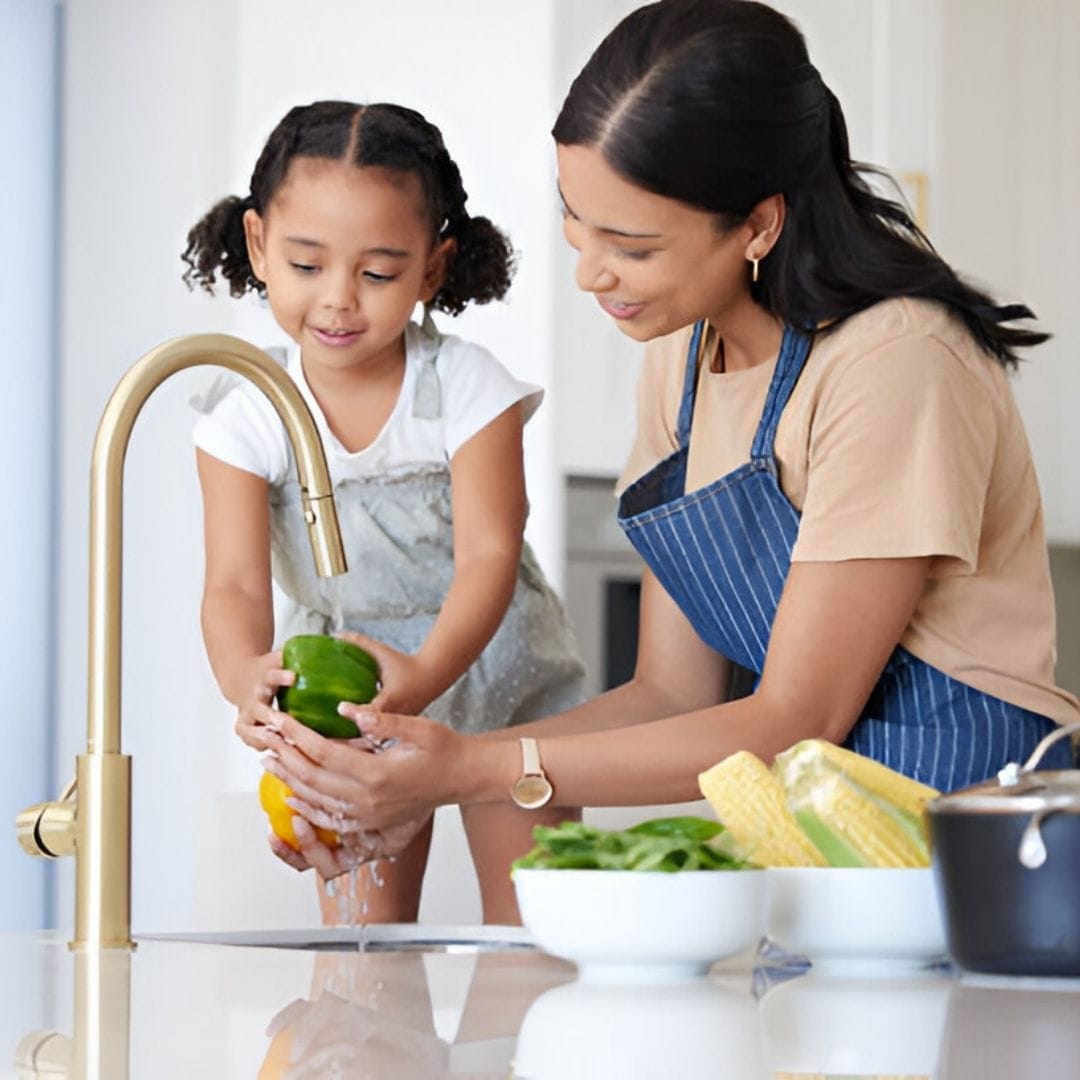 Mom with young girl washing bell peppers in kitchen sink 9c47d78f 2b22 4c27 b6da fffc51daec7c - High Quality Product Image